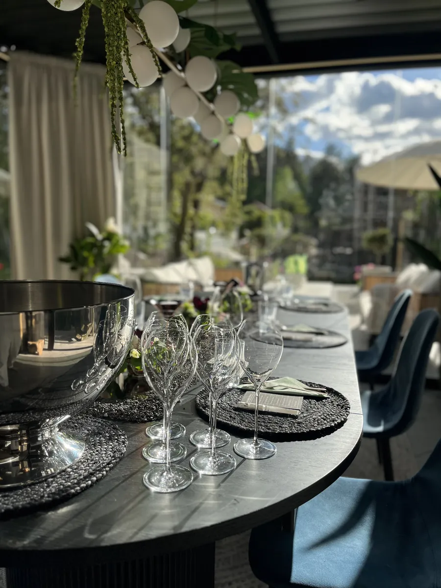 The glasses set out before the guests arrive