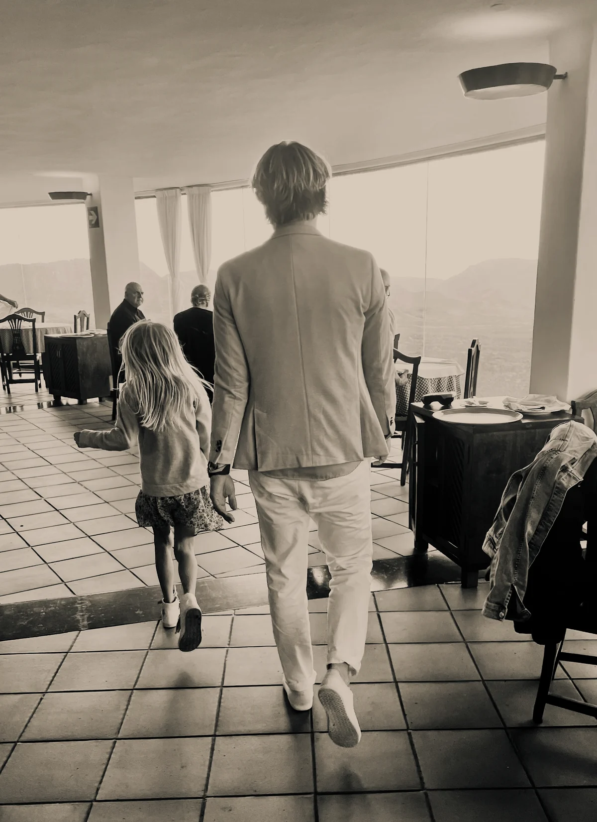 Two generations heading out onto the terrace