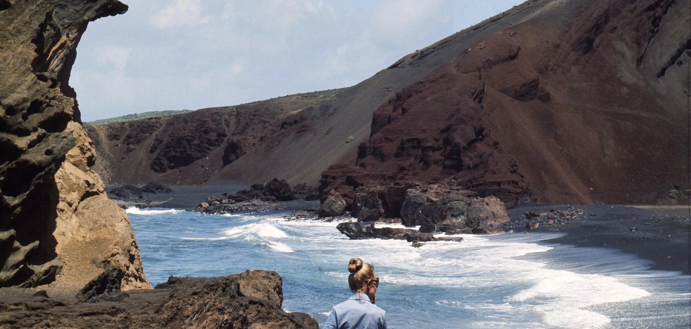 Black beach and red cliffs on Lanzarote, early 1970s